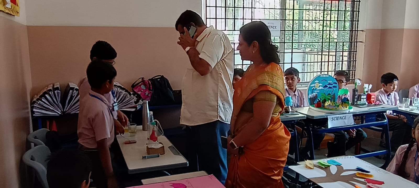 Happy parents sharing positive feedback about IKV School in Bangalore