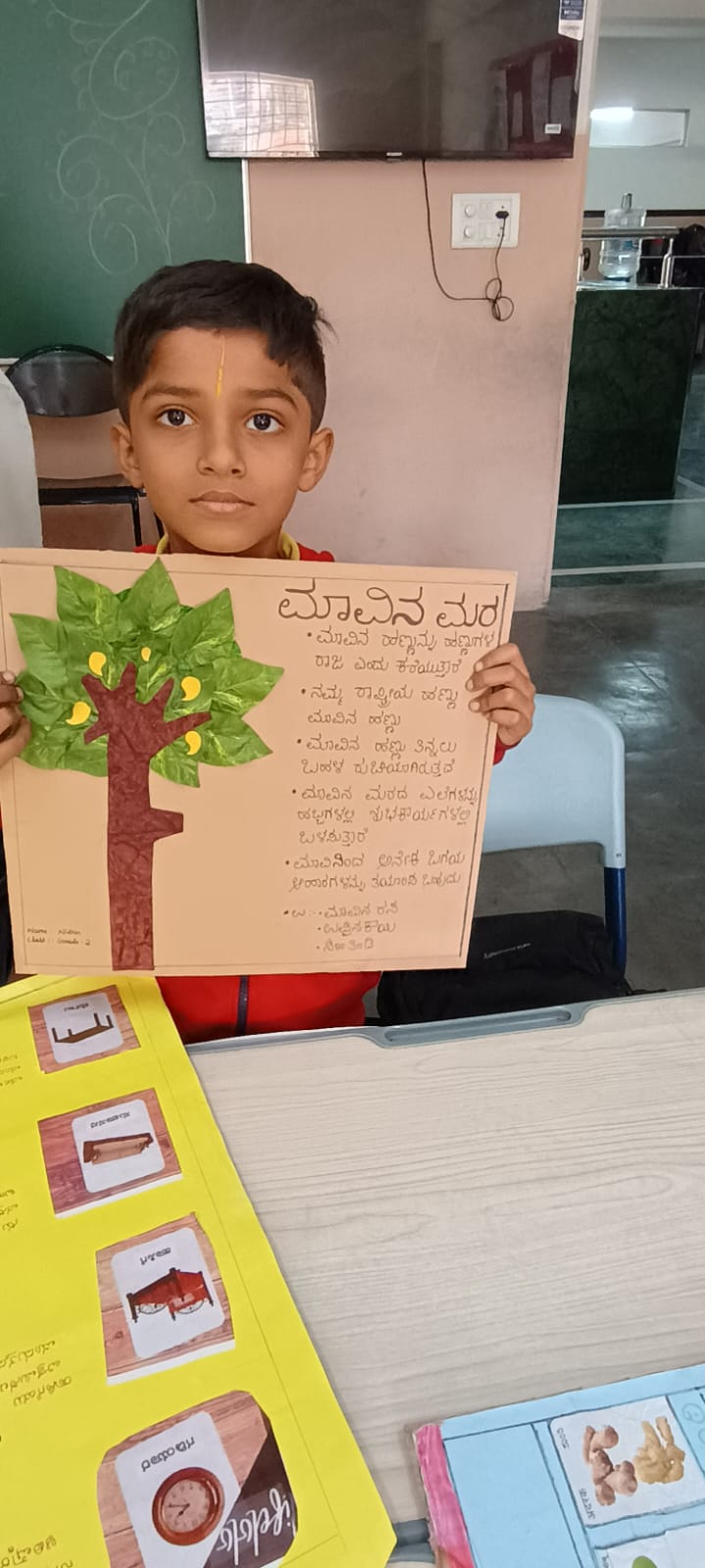 Teacher guiding students in arts and crafts for holistic development