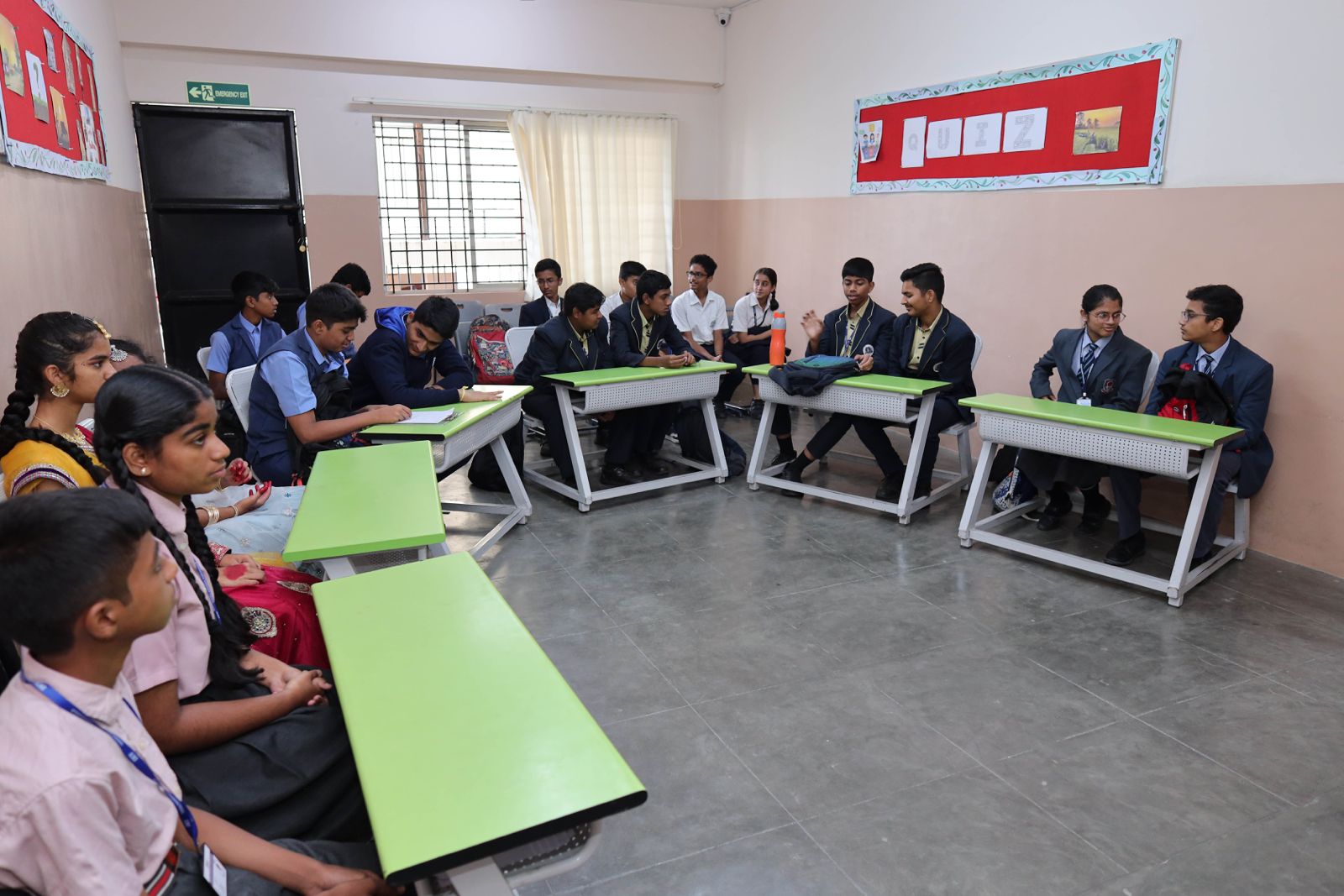 Teacher guiding students for CBSE improvement exams