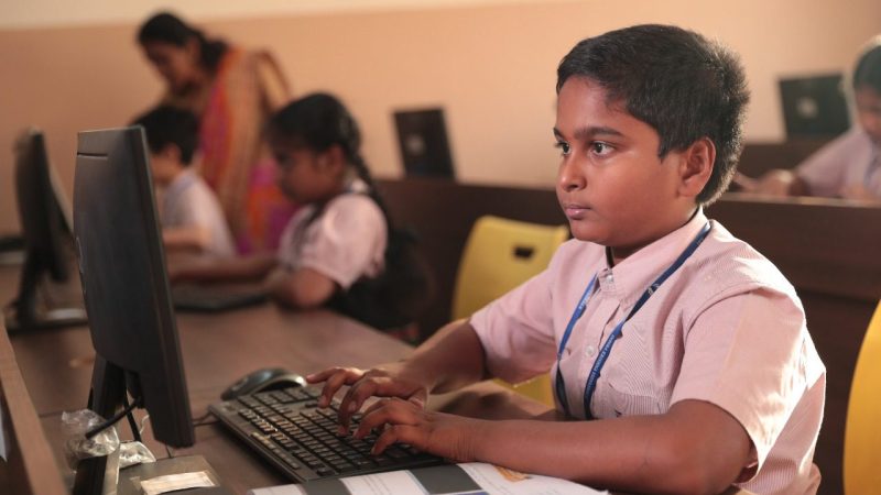 Students using computers in IKV computer lab for interactive learning