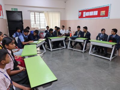 Teacher guiding students for CBSE improvement exams