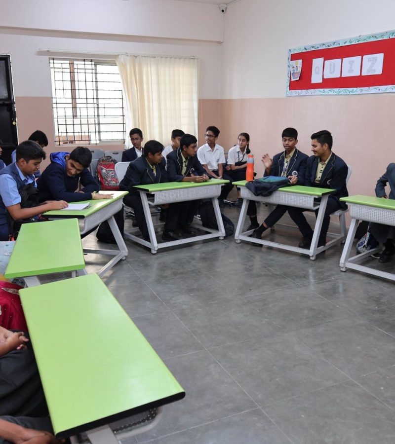 Teacher guiding students for CBSE improvement exams